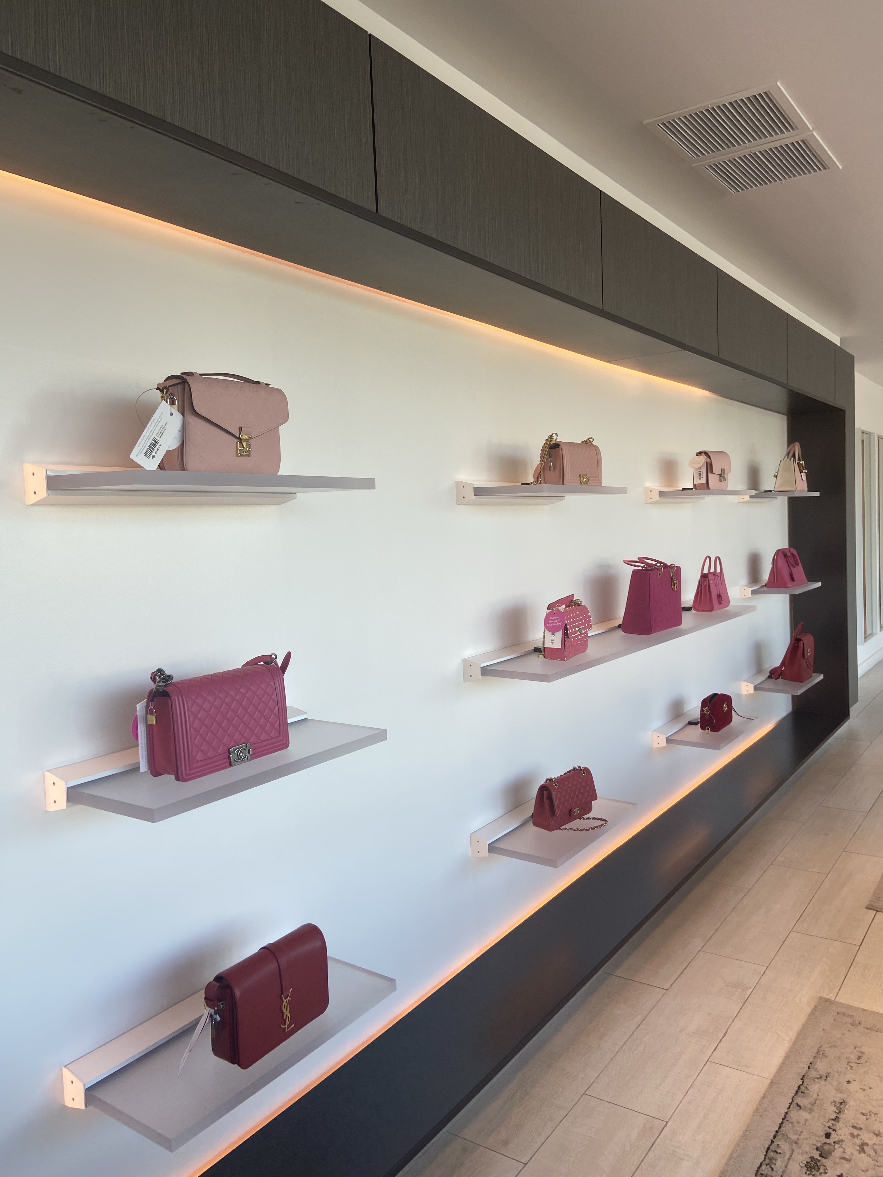 Authentic vs counterfeit Louis Vuitton bag display